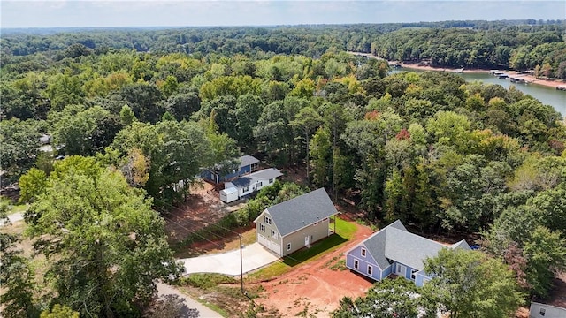 aerial view with a water view and a view of trees