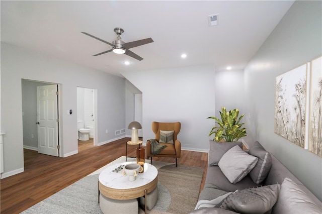 sitting room with ceiling fan and dark hardwood / wood-style floors