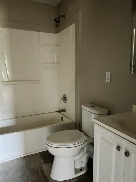 full bathroom with vanity, toilet, and shower / tub combination