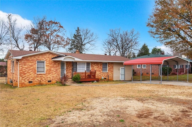 ranch-style home featuring a front yard and a carport