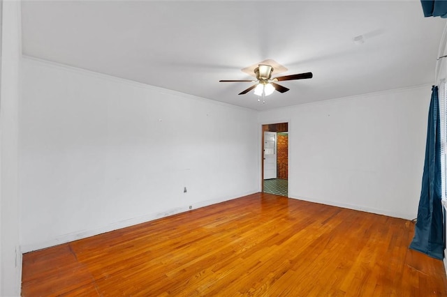 empty room featuring hardwood / wood-style floors and ceiling fan