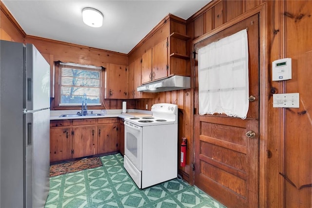 kitchen featuring stainless steel refrigerator with ice dispenser, electric range, and sink