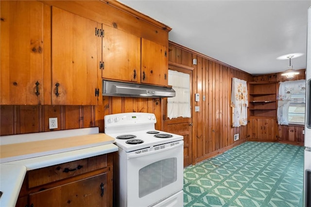 kitchen with white range with electric stovetop, wood walls, and carpet