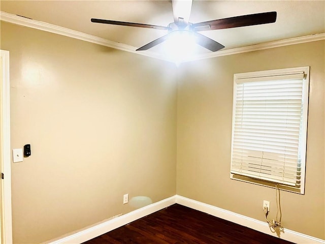 empty room featuring ceiling fan, dark wood-type flooring, and ornamental molding