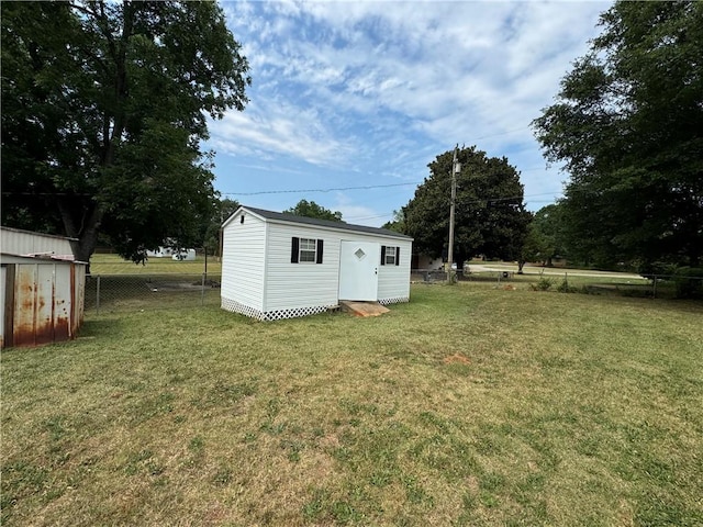 view of outdoor structure with a yard