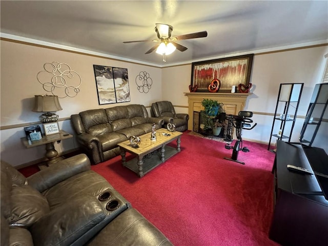 living room with carpet, ceiling fan, and ornamental molding