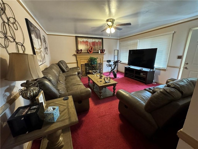 carpeted living room with crown molding and ceiling fan