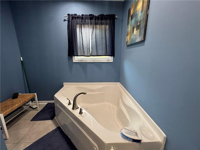 bathroom featuring tile patterned flooring and a bath