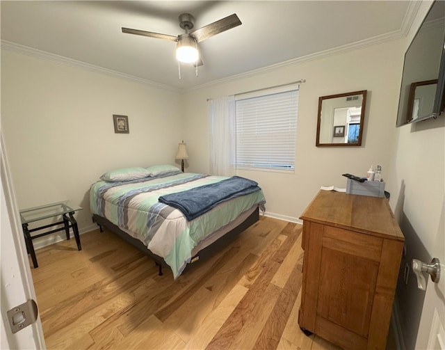 bedroom featuring light hardwood / wood-style flooring, ceiling fan, and ornamental molding