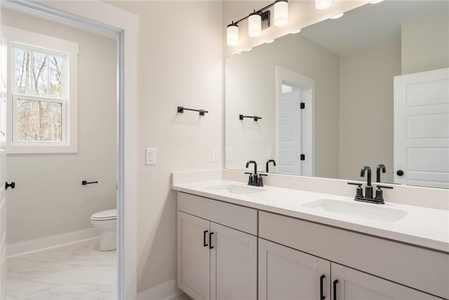 bathroom featuring vanity and toilet