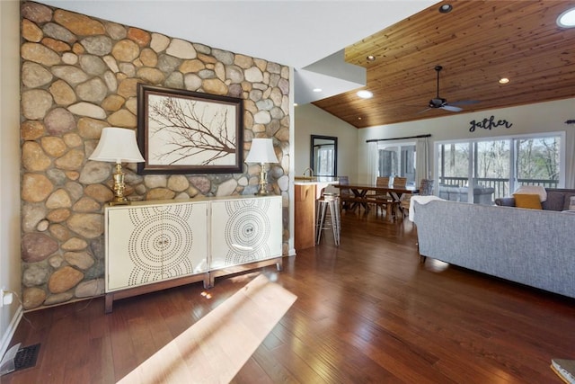 living room featuring ceiling fan, dark wood-type flooring, wooden ceiling, and vaulted ceiling