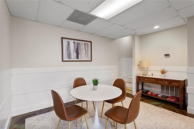 dining room with a paneled ceiling