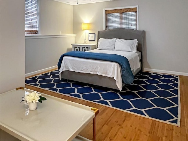 bedroom with wood-type flooring