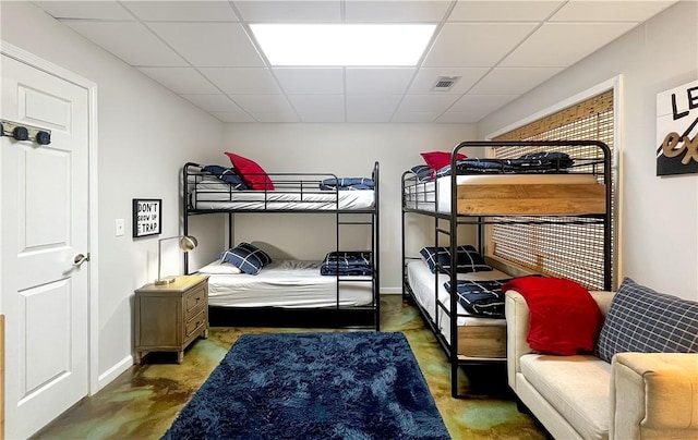 bedroom with a paneled ceiling