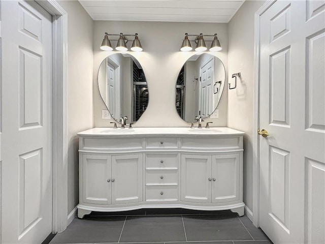 bathroom featuring tile patterned flooring and vanity