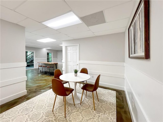 dining area with a paneled ceiling