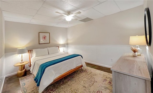 bedroom with a paneled ceiling and ceiling fan