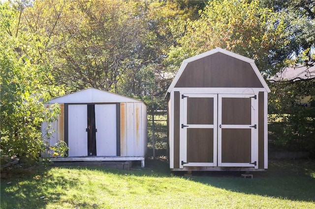 view of outbuilding featuring a lawn