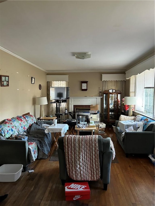 living room featuring a brick fireplace, dark hardwood / wood-style flooring, and crown molding