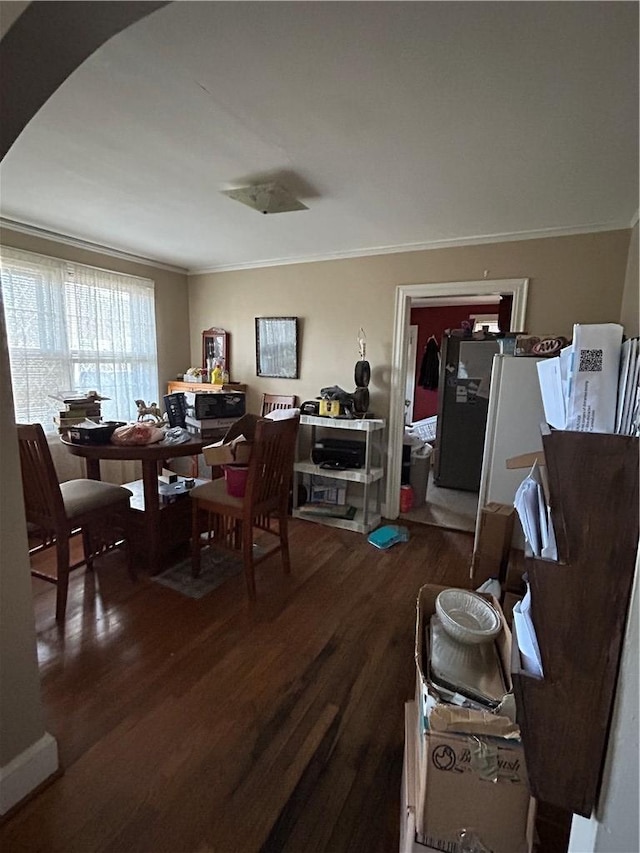 dining room with ornamental molding and hardwood / wood-style floors