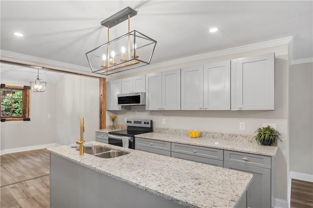 kitchen with gray cabinetry, sink, hanging light fixtures, ornamental molding, and stainless steel appliances