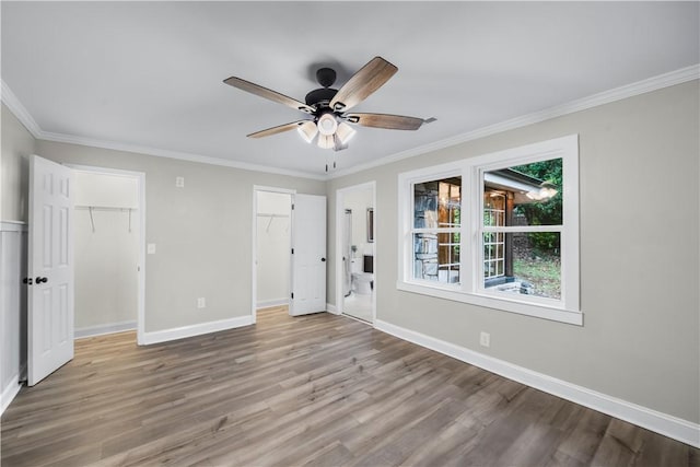 interior space featuring light hardwood / wood-style flooring, ceiling fan, and ornamental molding