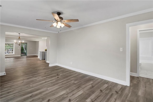 unfurnished living room with ceiling fan with notable chandelier, dark hardwood / wood-style floors, and crown molding