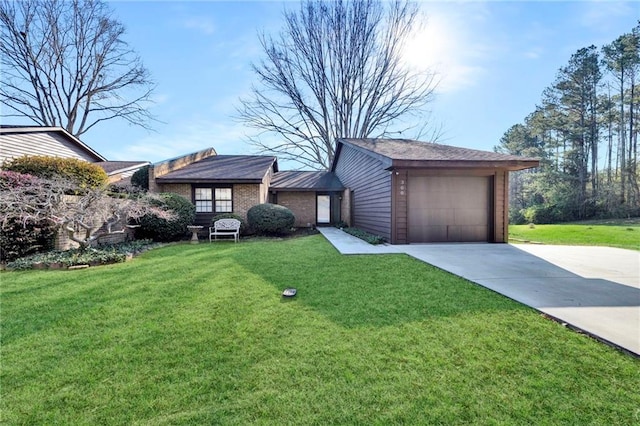 view of front of property with a front yard and a garage