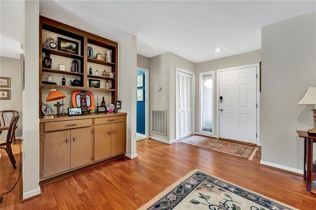 foyer entrance featuring light wood-type flooring