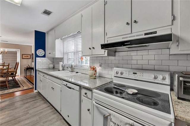 kitchen featuring sink, white cabinets, white appliances, and light wood-type flooring