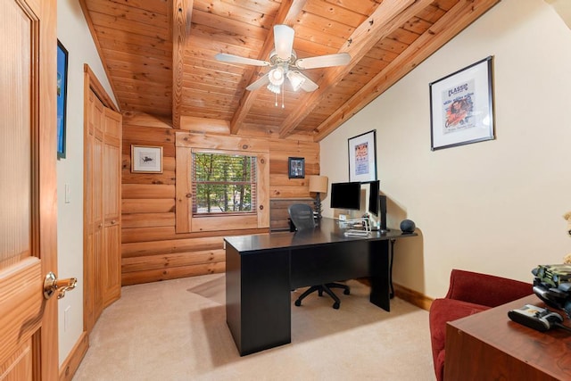 carpeted home office with ceiling fan, wood walls, wooden ceiling, and lofted ceiling with beams