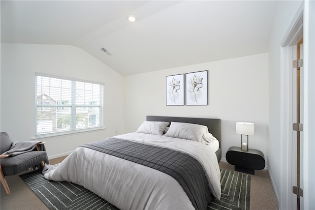 bedroom featuring carpet floors and lofted ceiling