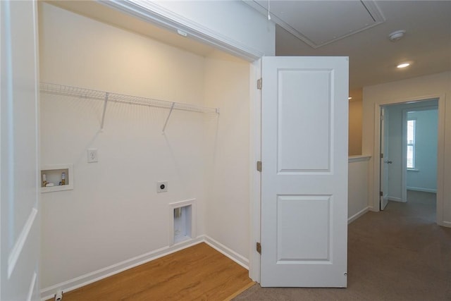 washroom featuring electric dryer hookup, hardwood / wood-style floors, and washer hookup