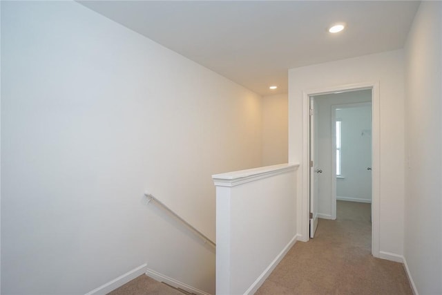 hallway with light carpet