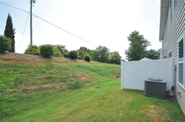 view of yard featuring central air condition unit