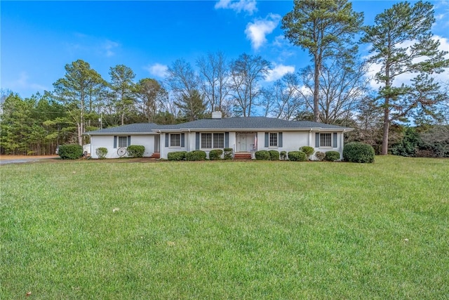 single story home featuring a front lawn