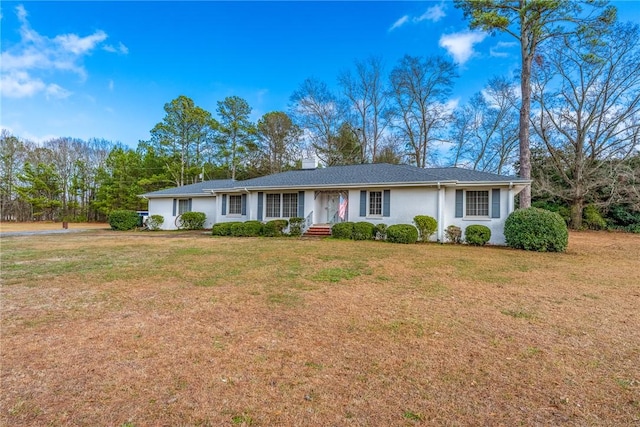 ranch-style home featuring a front yard