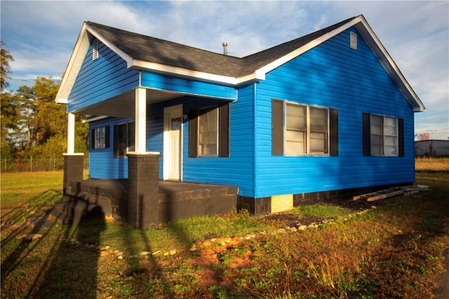 view of side of home featuring a porch