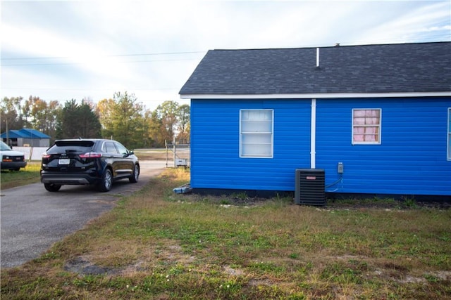 view of side of home featuring central air condition unit