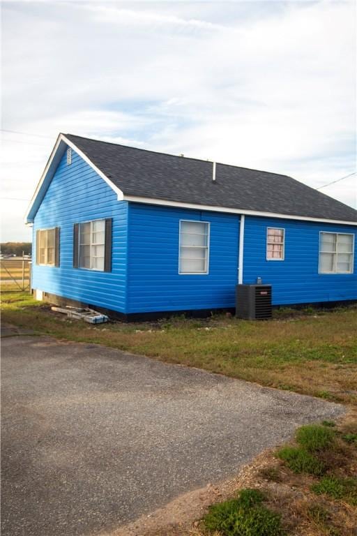 view of front of house with central air condition unit