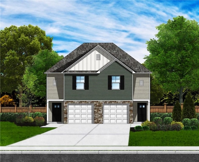 view of front of home featuring a front yard and a garage