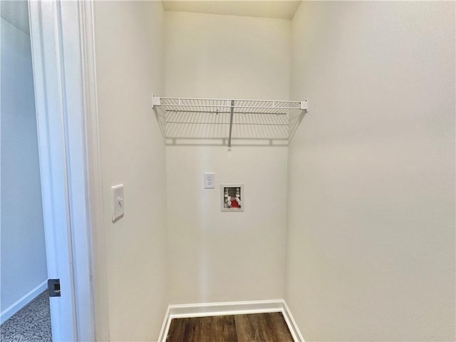 clothes washing area featuring dark hardwood / wood-style floors and hookup for a washing machine