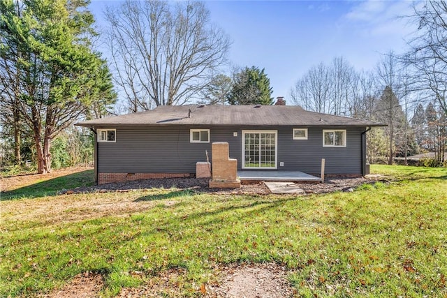 back of house with a yard and a patio