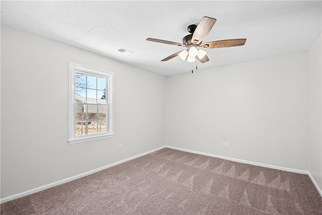 unfurnished room with ceiling fan and carpet floors