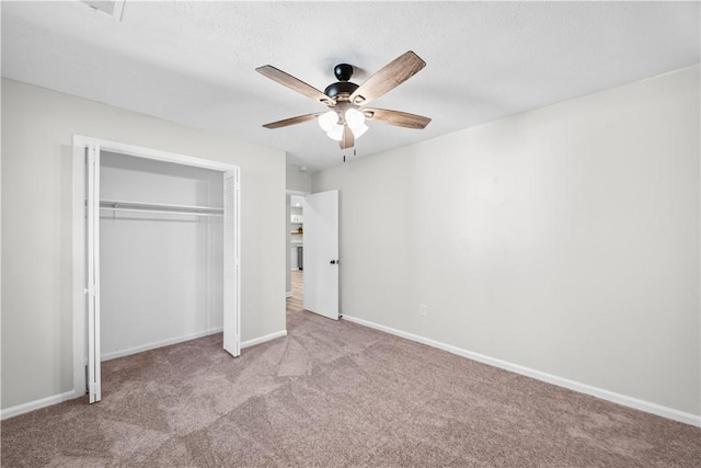 unfurnished bedroom with light carpet, a closet, and ceiling fan