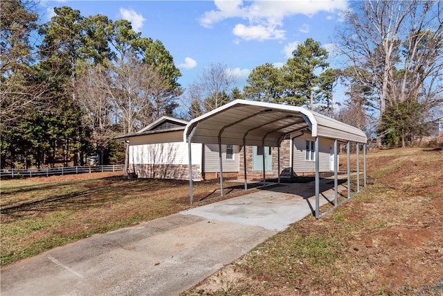 view of car parking with a carport and a yard