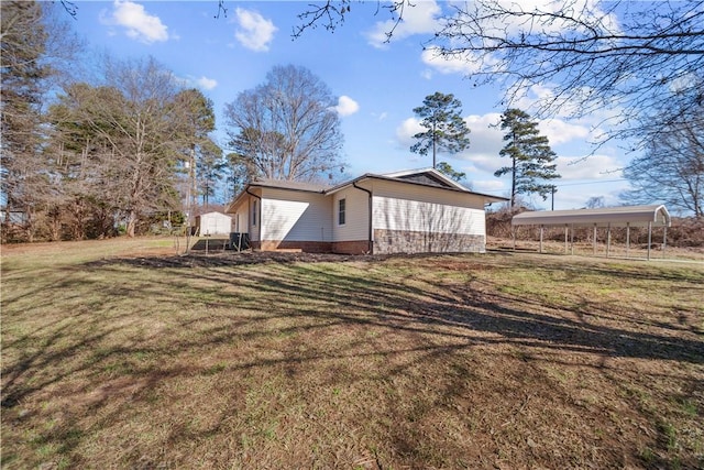 view of property exterior with a carport and a lawn