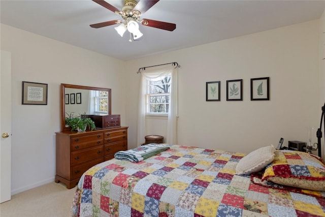 bedroom featuring light carpet and ceiling fan