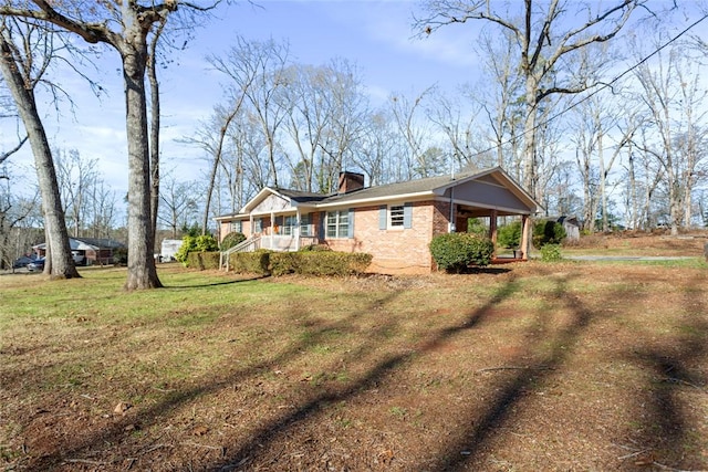 view of property exterior featuring a porch and a lawn