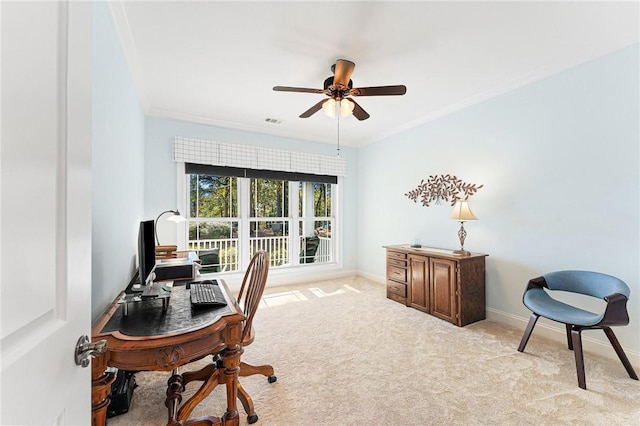 carpeted home office with ceiling fan and ornamental molding